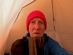 02C Showing signs of the altitude as I enjoy my morning coffee inside my tent outside Ak-Sai Travel Lenin Peak Camp 3 6100m